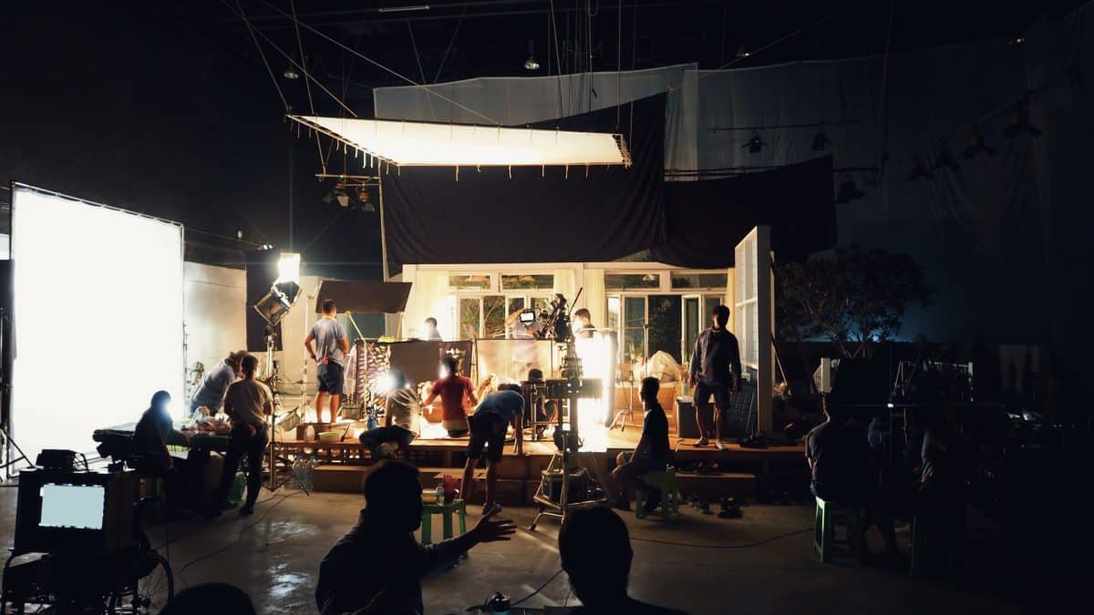 Various production professionals working on a film set.